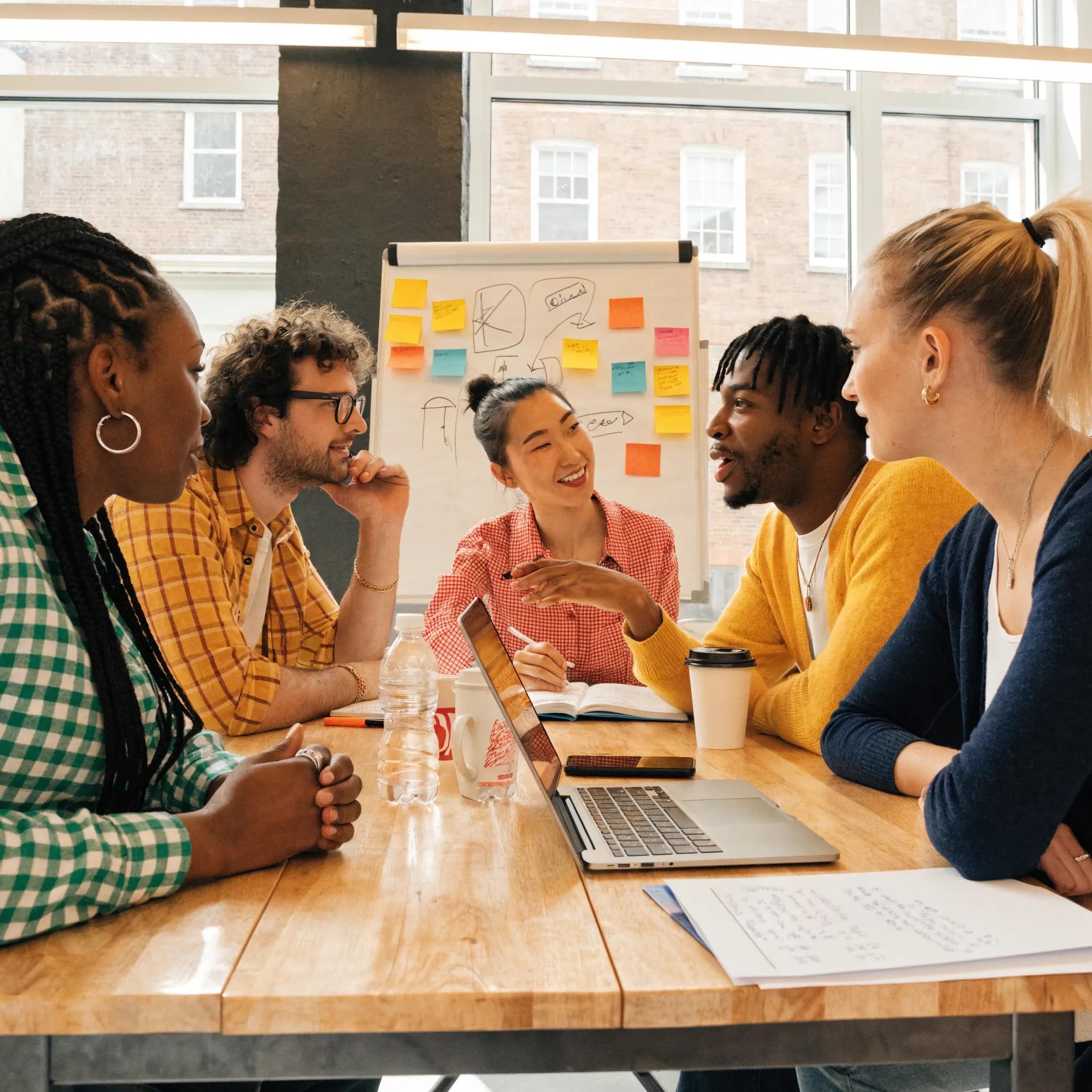 808fcba0 Ce05 4b04 B865 911752ea6f10 Diverse team brainstorming marketing strategies in a modern office setting